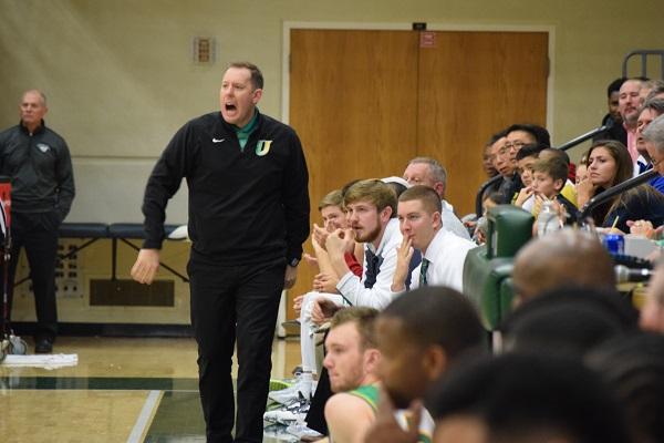 In the Intercity game vs. Bloomington High School, Coach McDowell tells the Pioneers to get back on defense.