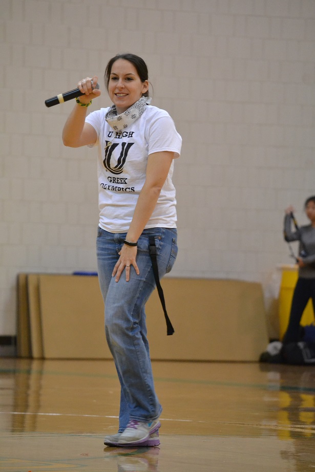 Biology teacher Melissa Doellman encourages freshman while they participate in the 2016 Greek Olympics.