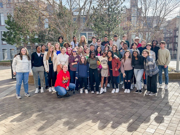 All student who attended the trip pose outside for a picture.