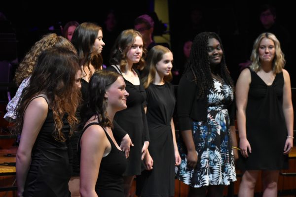Stella A Capella members Grace Yoder, Ava Frazier, Emy York, Grace Myers, Benedicta Johnson, and Annika Armstrong, perform at the first fall concert on Oct. 12.  