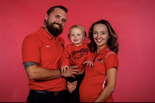 The photograph is during our media day photo shoot for cheer. That is my husband and I and our daughter Everly. I was still pregnant with my son then, who we named Emmett, said Natalie Montoney. The photo was taken by @isuredbirds by @nickolasparramedia