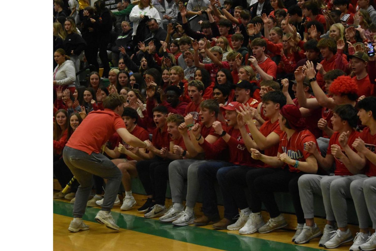 Spirit stick holder Luke Deffenbaugh (12) leads the U-Crew through the roller coaster during the varsity boys basketball game against Central Catholic on January 25, 2025. The game ended in a win 57-55.